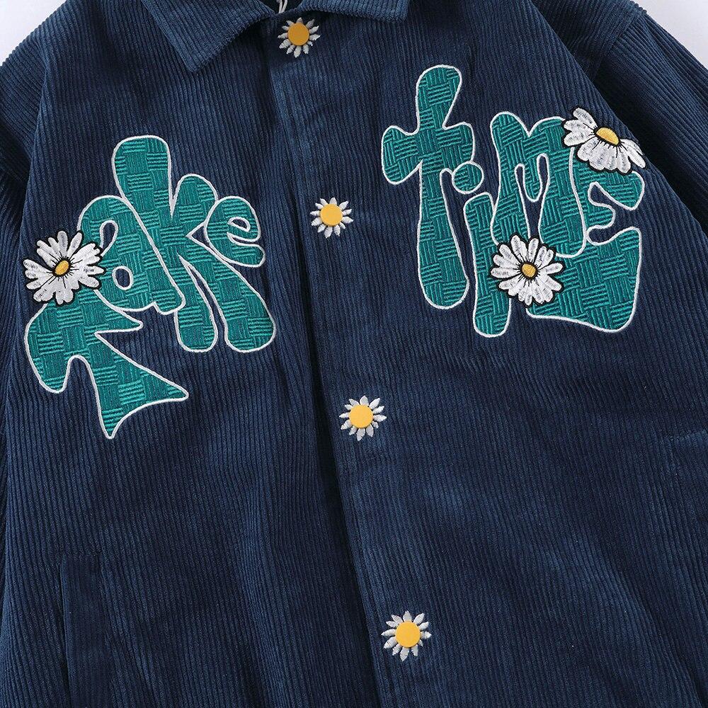 Men's corduroy jacket featuring daisy flowers and letter embroidery, showcasing a loose fit and retro style.