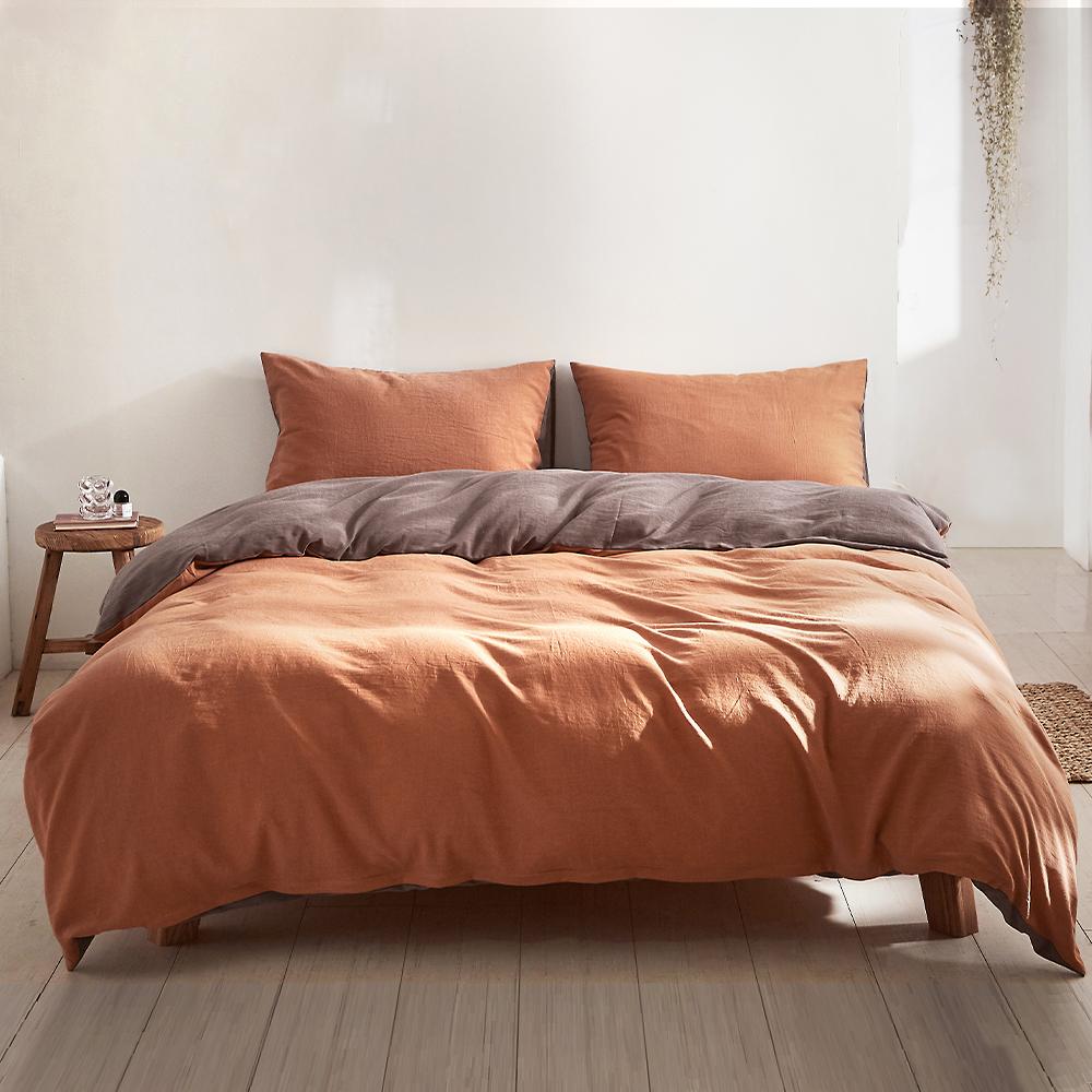 Cosy Club Quilt Cover Set in earthy pumpkin color, showcasing soft washed cotton fabric and stylish two-tone design.