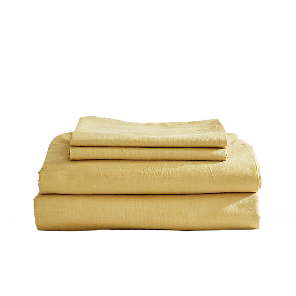 Cosy Club Sheet Set in yellow, featuring a flat sheet, fitted sheet, and pillow cases made from soft washed cotton.