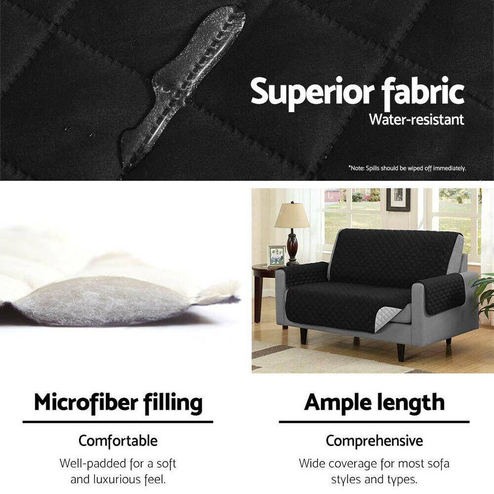 Reversible black and red couch cover protector for 2-seater sofas, featuring a quilted design and anti-slip backing.