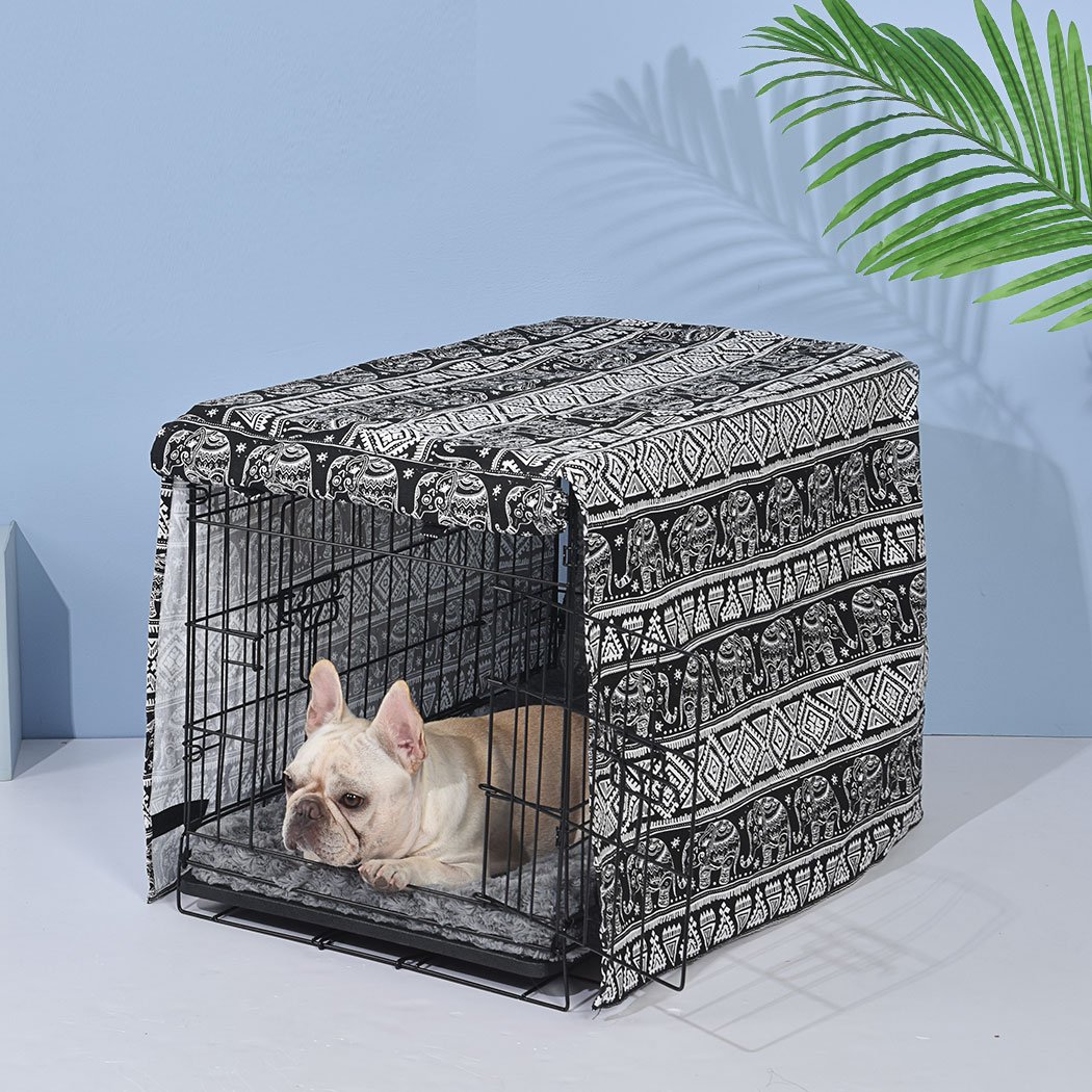 A stylish black crate cover made from durable 600D oxford fabric, featuring a double-sided rolling curtain and hook-and-loop closure, designed for pet comfort.