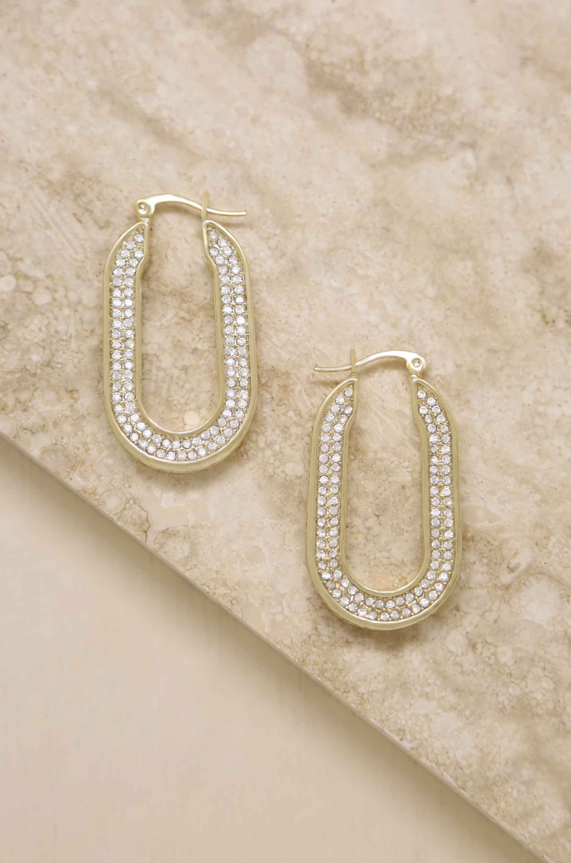 Elegant Crystal Spotlight 18k Gold Plated Hoops featuring glass accents, showcasing a luxurious design.