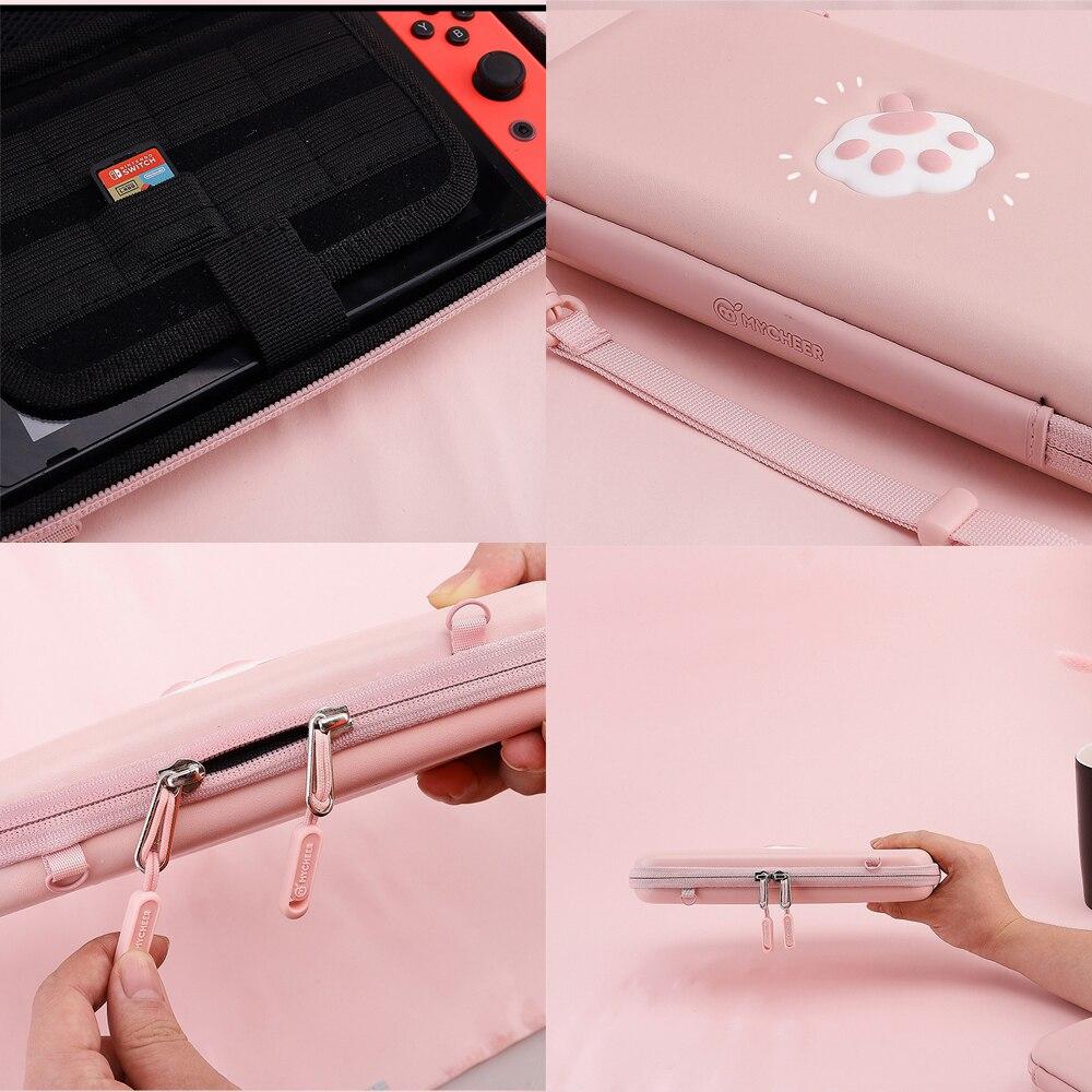 Cute pink cat bag designed for Nintendo Switch and Switch Lite, featuring hand and shoulder straps for easy carrying.