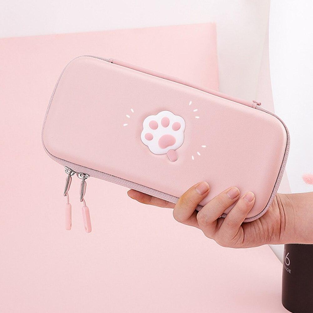 Cute pink cat bag designed for Nintendo Switch and Switch Lite, featuring hand and shoulder straps for easy carrying.