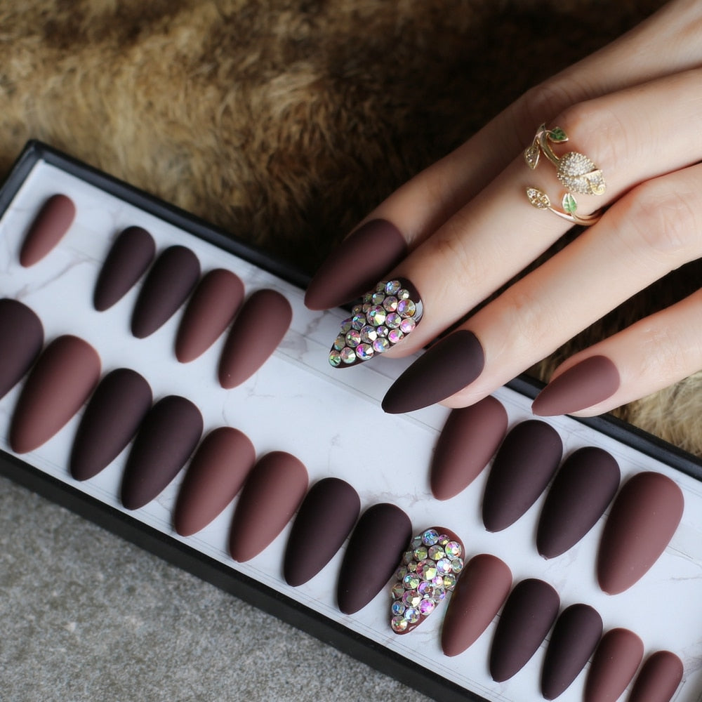 Dark coffee full stiletto press-on nails displayed in a stylish arrangement, showcasing their elegant design and color.