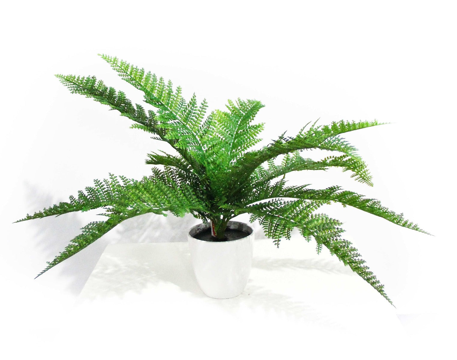 A lush, vibrant 45cm artificial Dense Fern Stem, showcasing realistic green foliage perfect for home decor.