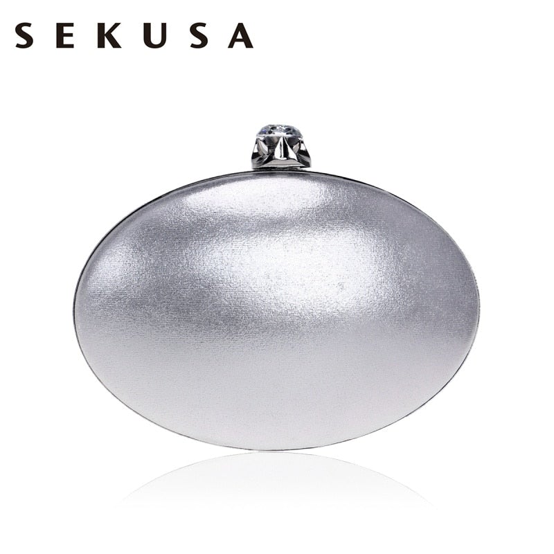 Elegant egg-shaped clutch for women adorned with rhinestones and a chain shoulder strap, perfect for evening events.