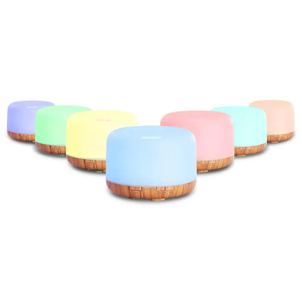 DEVANTI Aroma Diffuser with LED night light and wood base, showcasing its modern design and features.