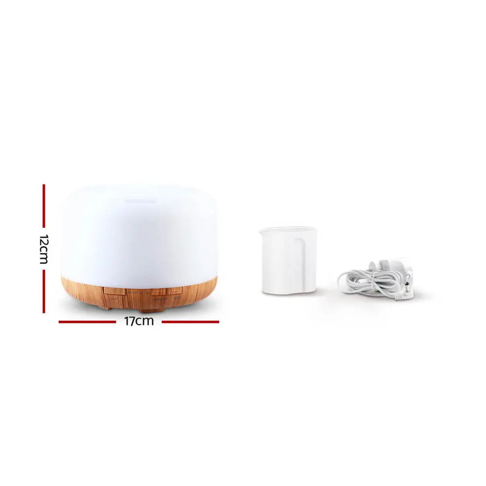 DEVANTI Aroma Diffuser with LED night light and wood base, showcasing its modern design and features.