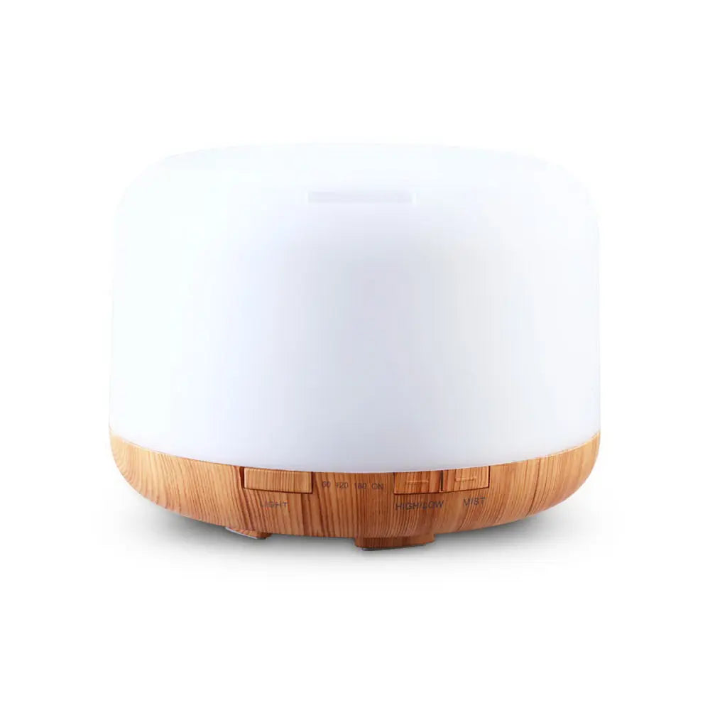 DEVANTI Aroma Diffuser with LED night light and wood base, showcasing its modern design and features.