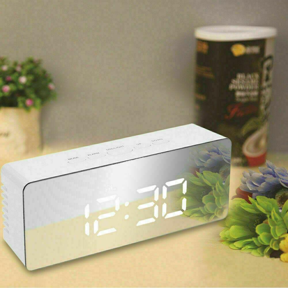 Digital LED Mirror Alarm Clock displaying time and temperature with a sleek mirror finish.