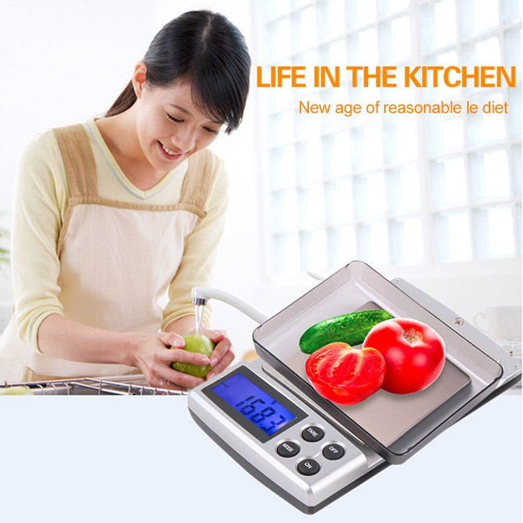 Digital Pocket Scale in black color with stainless steel tray, displaying weight measurements.