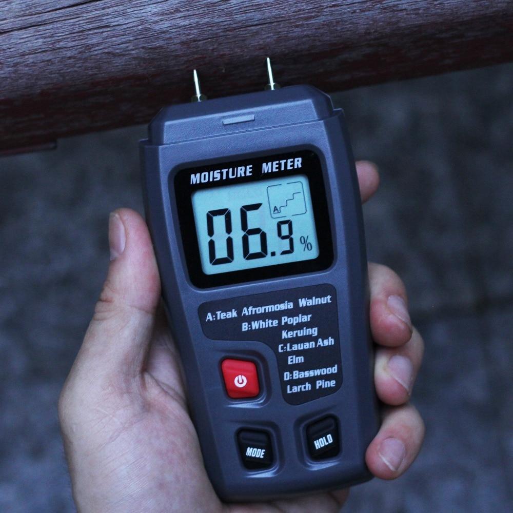 Digital Wood Moisture Meter EMT01 with LCD display, measuring wood moisture levels from 0 to 99.9%, designed for woodworking and timber assessment.