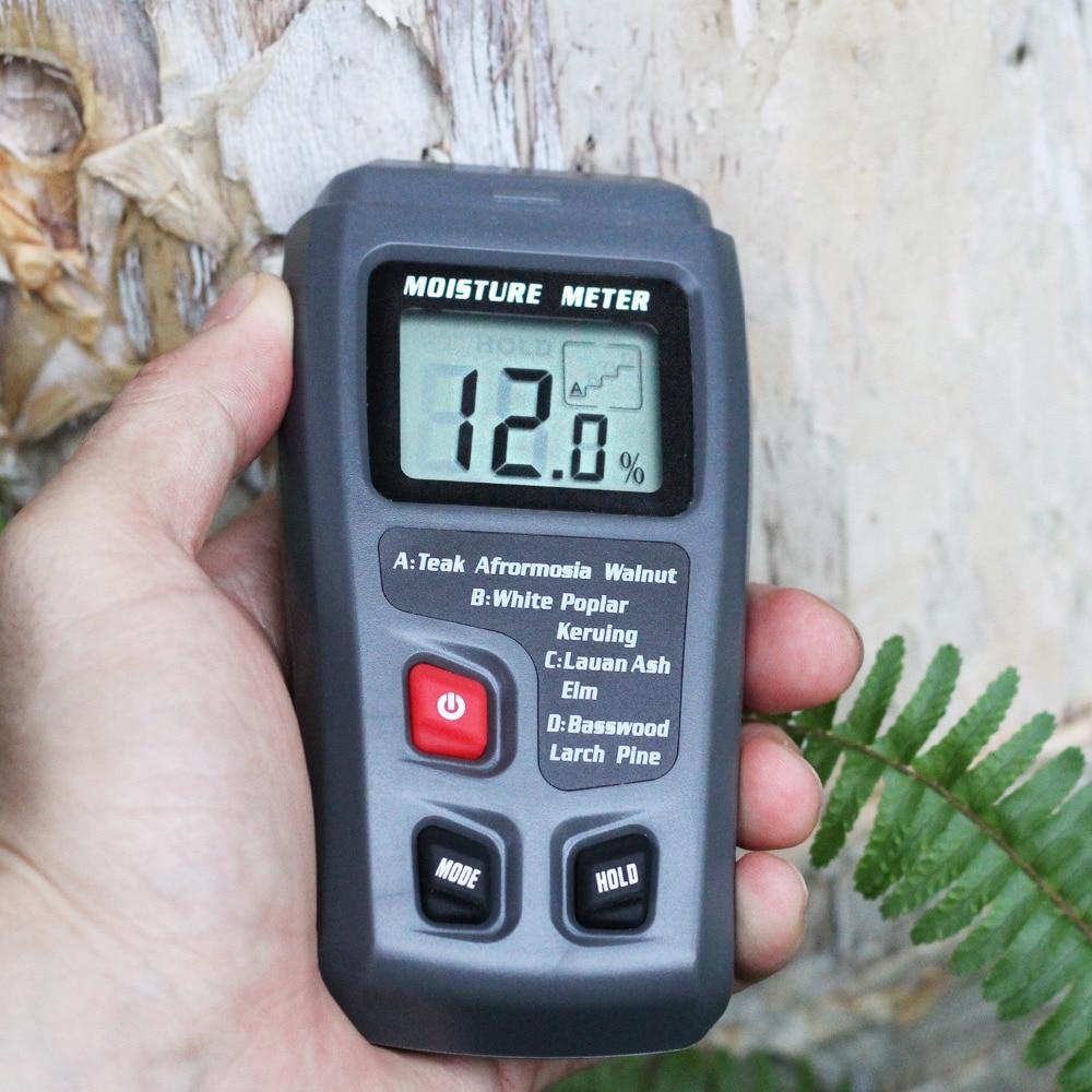 Digital Wood Moisture Meter EMT01 with LCD display, measuring wood moisture levels from 0 to 99.9%, designed for woodworking and timber assessment.