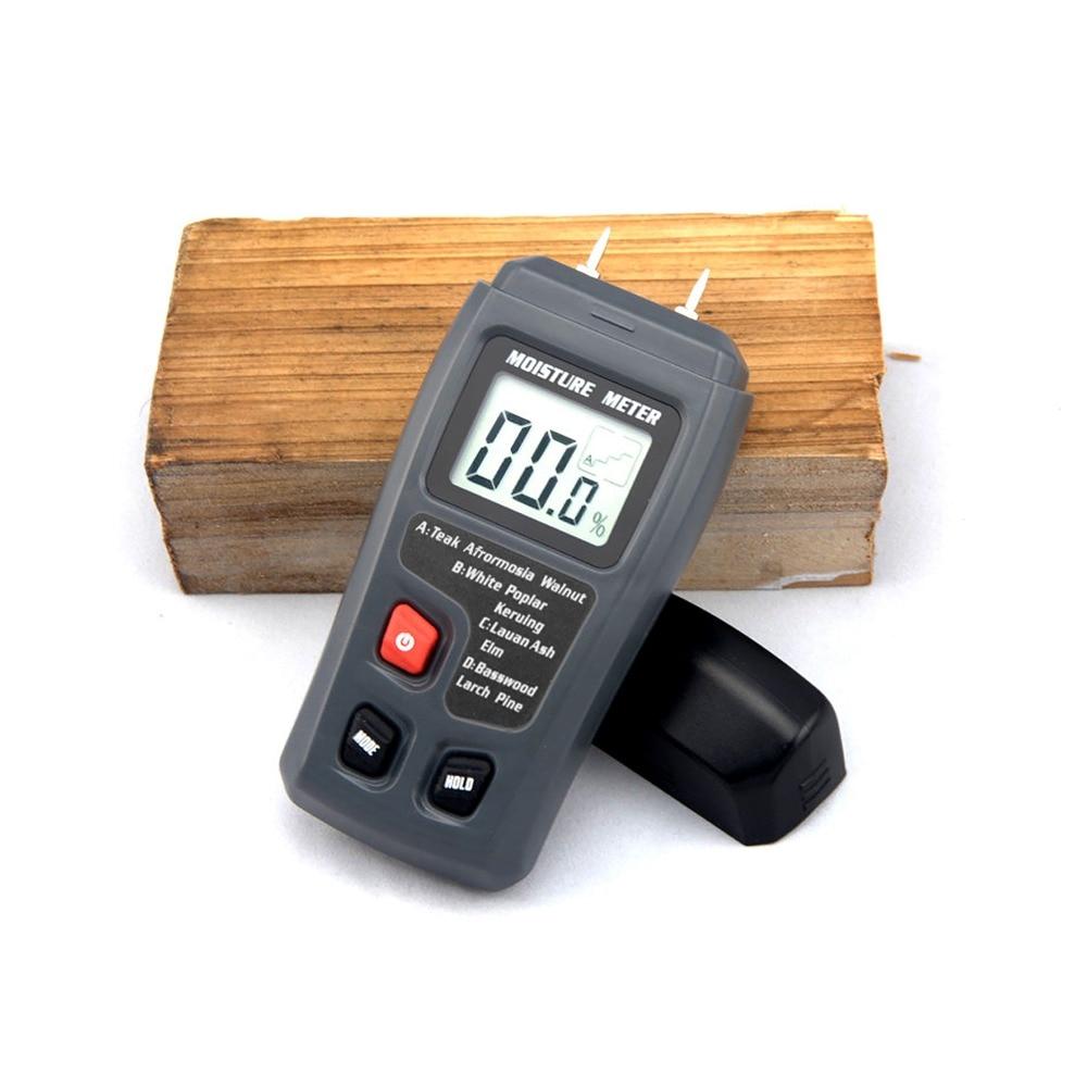 Digital Wood Moisture Meter EMT01 with LCD display, measuring wood moisture levels from 0 to 99.9%, designed for woodworking and timber assessment.