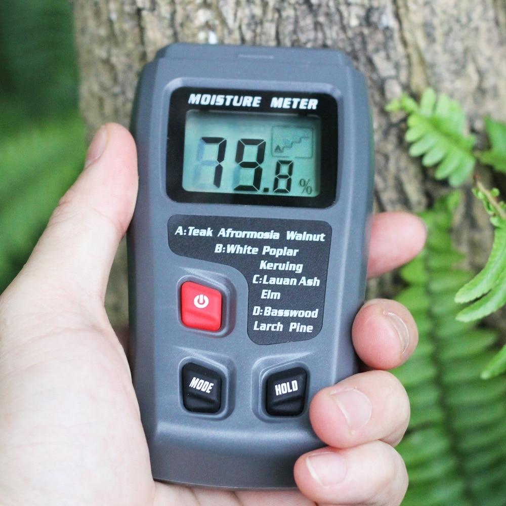 Digital Wood Moisture Meter EMT01 with LCD display, measuring wood moisture levels from 0 to 99.9%, designed for woodworking and timber assessment.