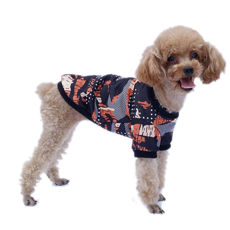 A small dog wearing a camouflage fleece sweater, showcasing its stylish design and warm fabric, perfect for autumn and winter.