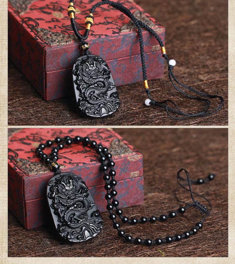 Hand-carved black obsidian dragon pendant necklace, symbolizing protection and wealth attraction.