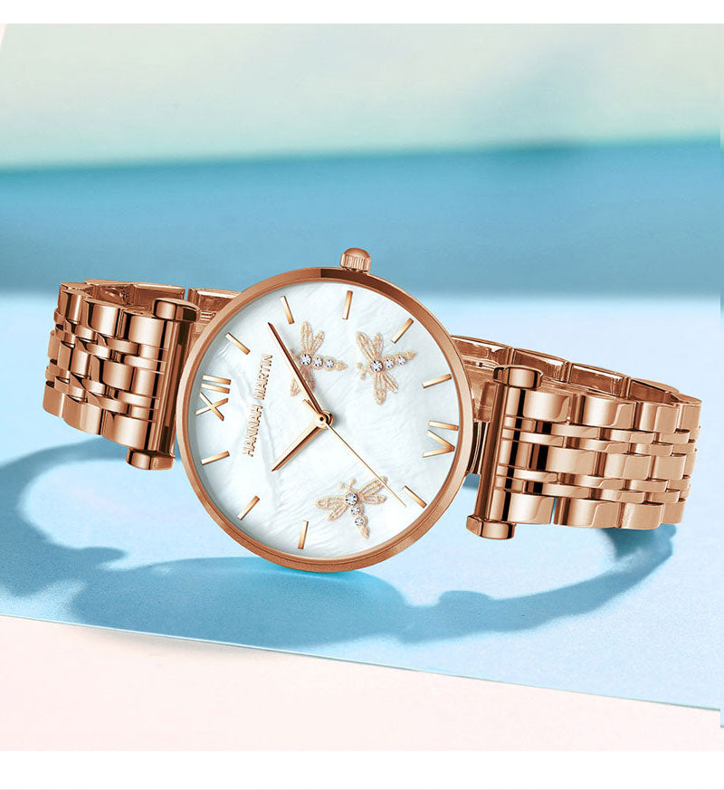 Dragonfly Design White Oyster Scallop Dial Japan Quartz Ladies Watch with stainless steel band and elegant scallop dial.