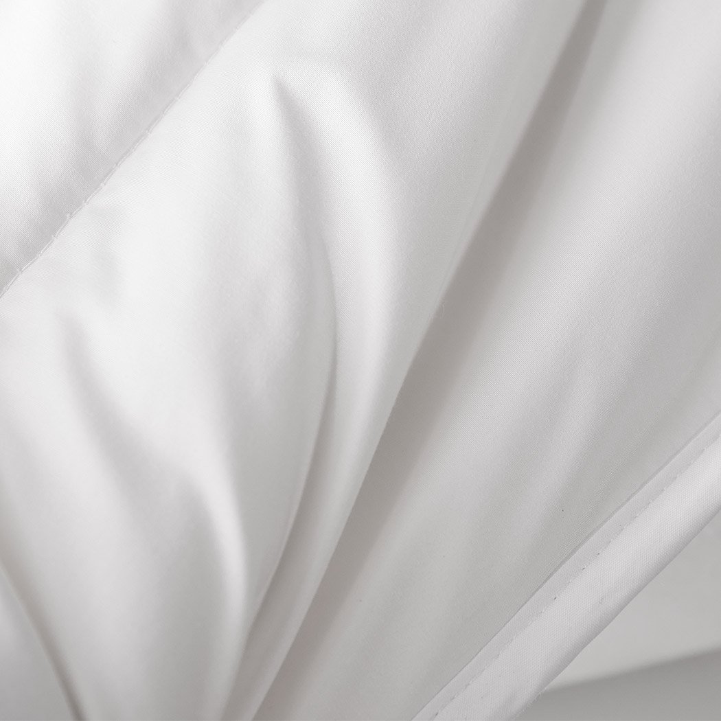 DreamZ 100% Wool Quilt in white, showcasing its soft texture and elegant diamond stitching design.