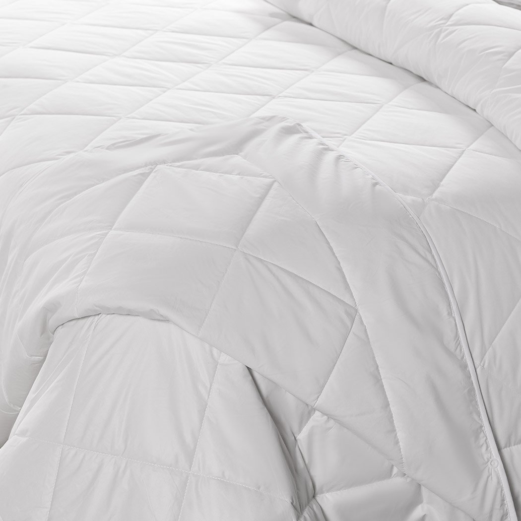 DreamZ 100% Wool Quilt in white, showcasing its soft texture and elegant diamond stitching design.