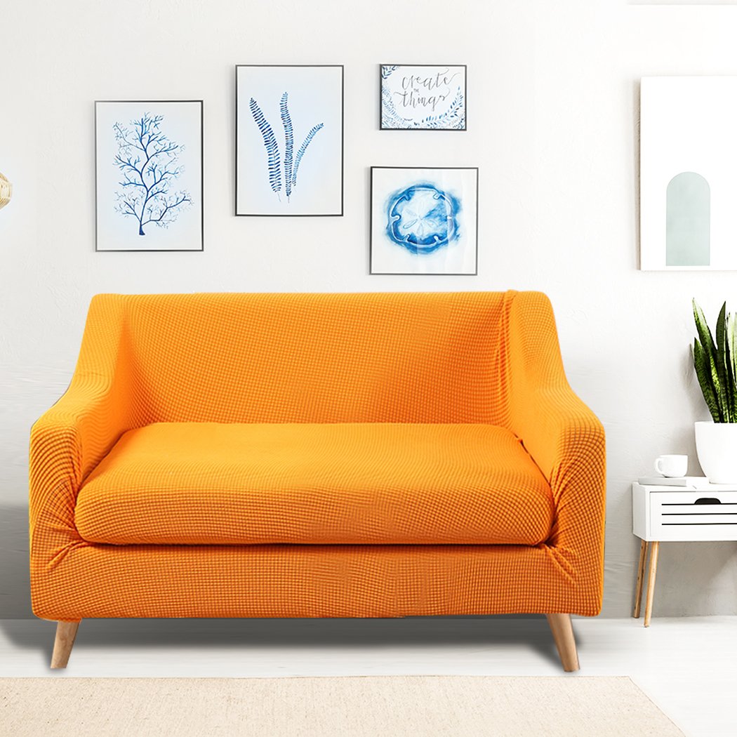 DreamZ Couch Sofa Seat Covers in vibrant orange, designed for 2-seater sofas, showcasing stretchable fabric and well-stitched edges.