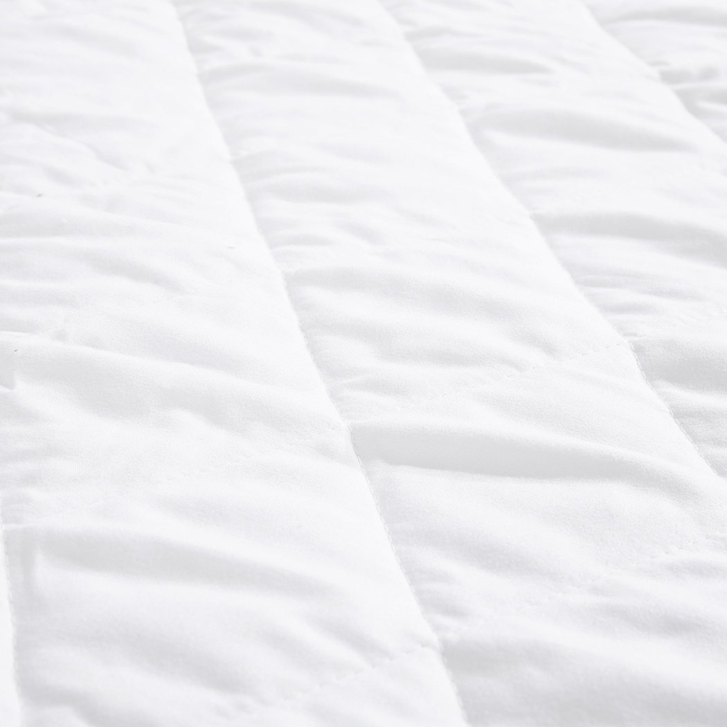 DreamZ Fully Fitted Waterproof Microfiber Mattress Protector in double size, featuring a quilted diamond pattern and soft brushed microfiber surface.