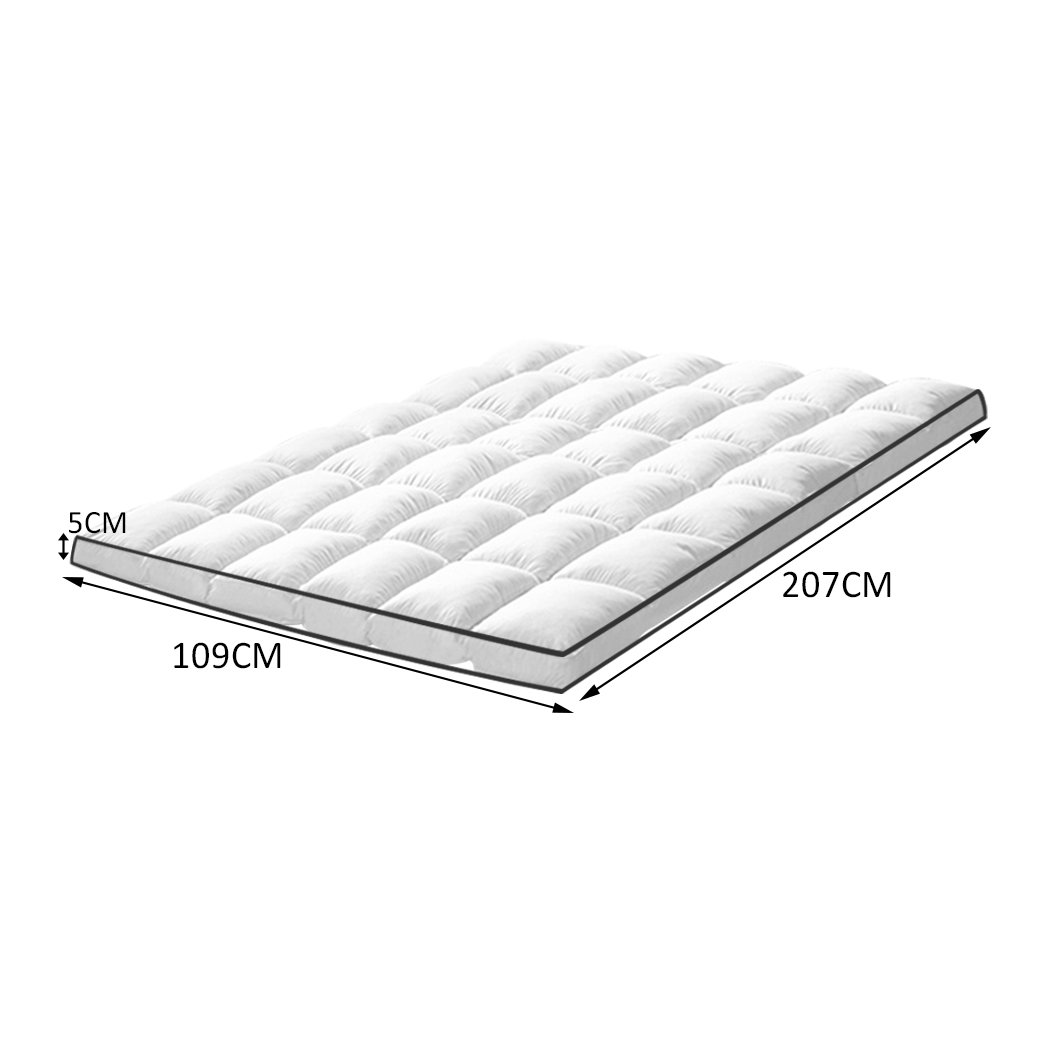 DreamZ Luxury Bedding Pillowtop Mattress Topper in white, showcasing its plush 5cm thickness and sewn pockets for even filling distribution.