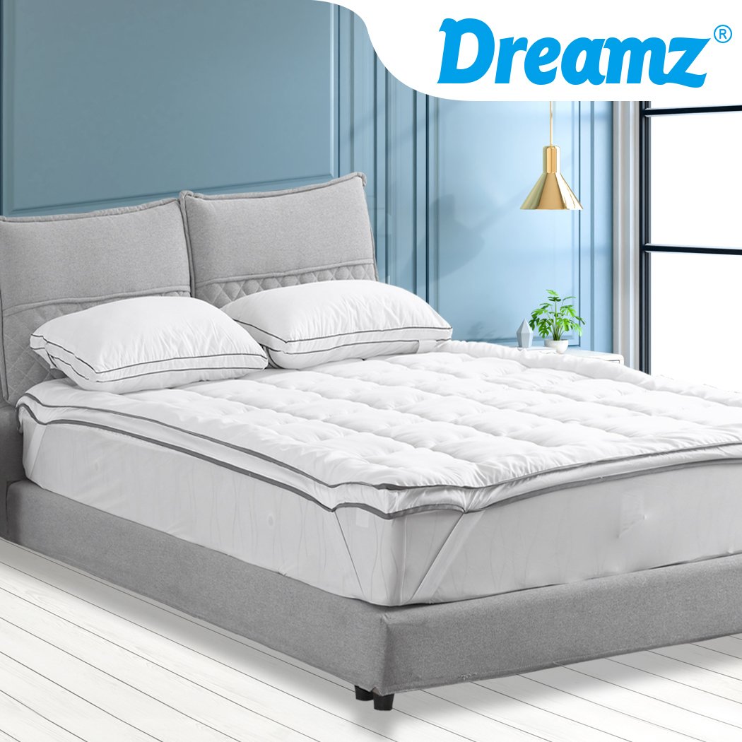 DreamZ Luxury Bedding Pillowtop Mattress Topper in white, showcasing its plush 5cm thickness and sewn pockets for even filling distribution.