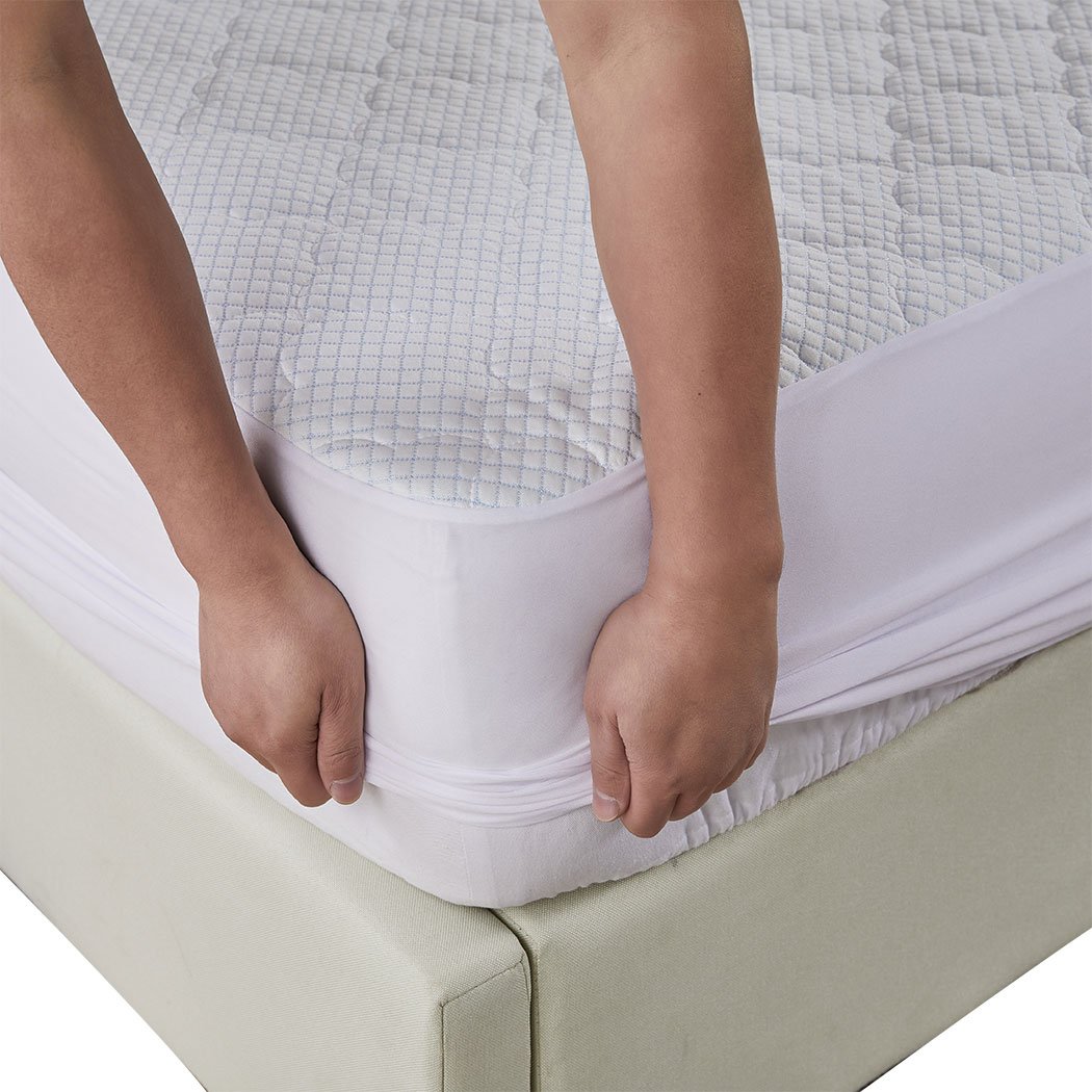 Dreamz Mattress Protector Topper in white, showcasing cool fabric and plush pillowtop design, perfect for king-sized beds.