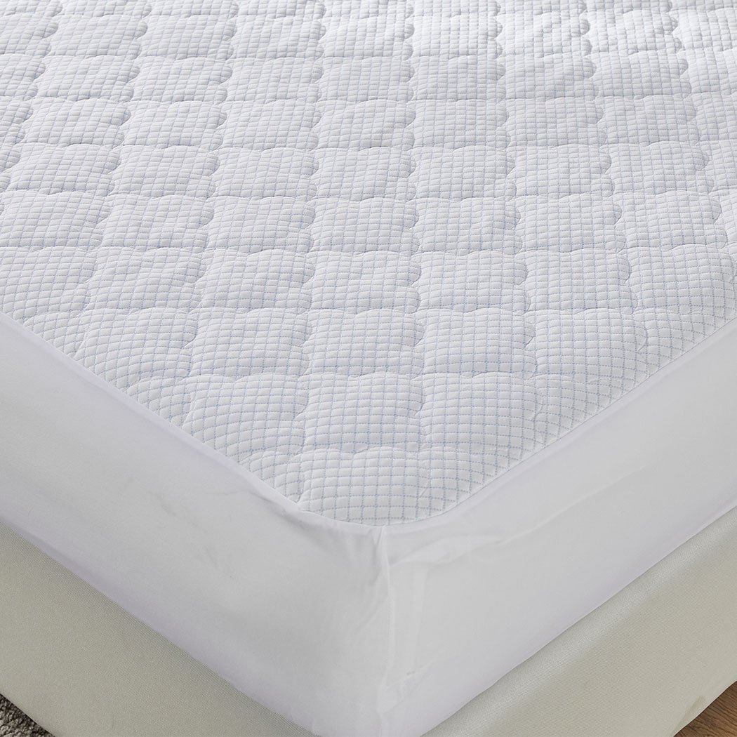 Dreamz Mattress Protector Topper in white, showcasing cool fabric and plush pillowtop design, perfect for king-sized beds.