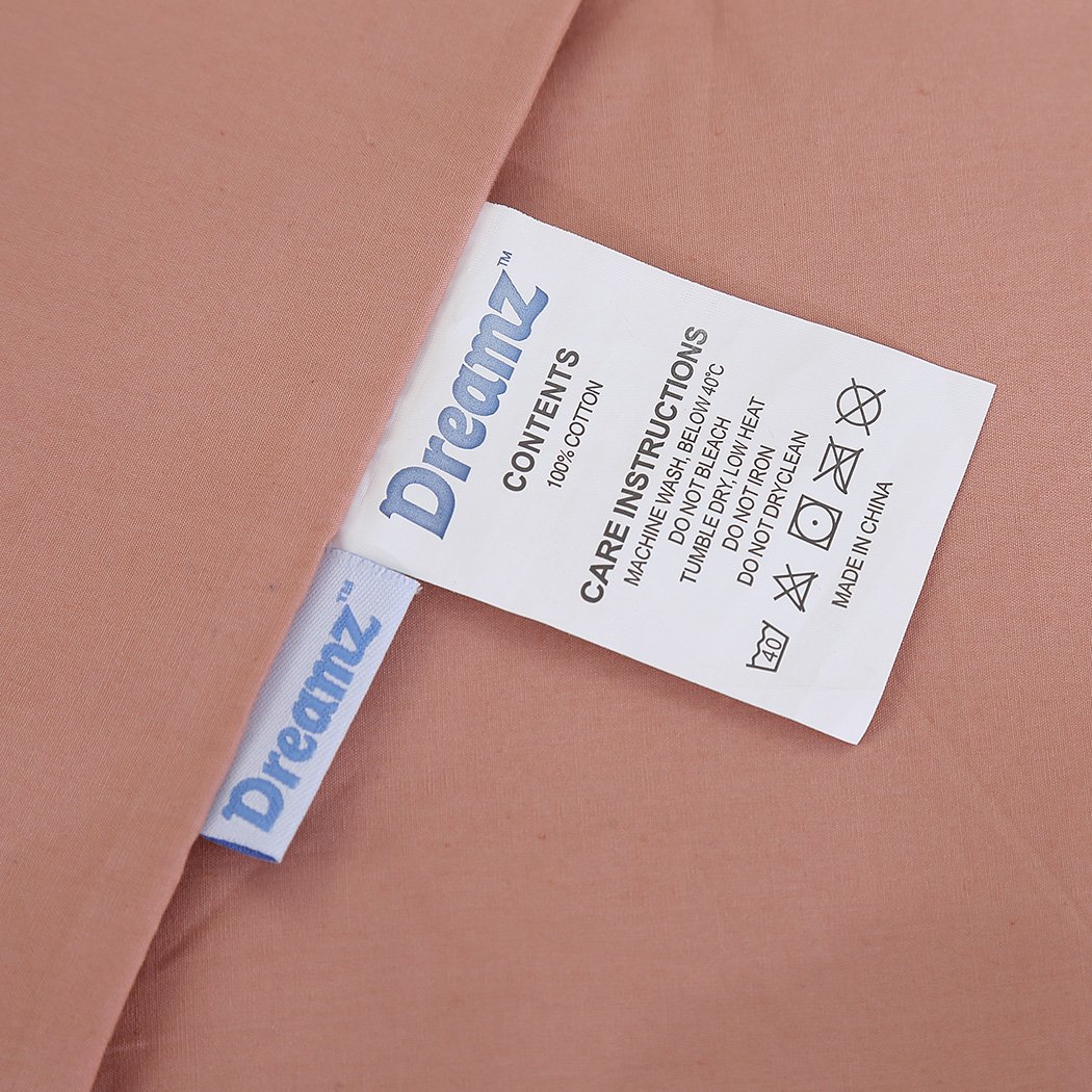 DreamZ Weighted Blanket in pink, featuring dual covers made of cotton and polyester, designed for deep relaxation and comfort.