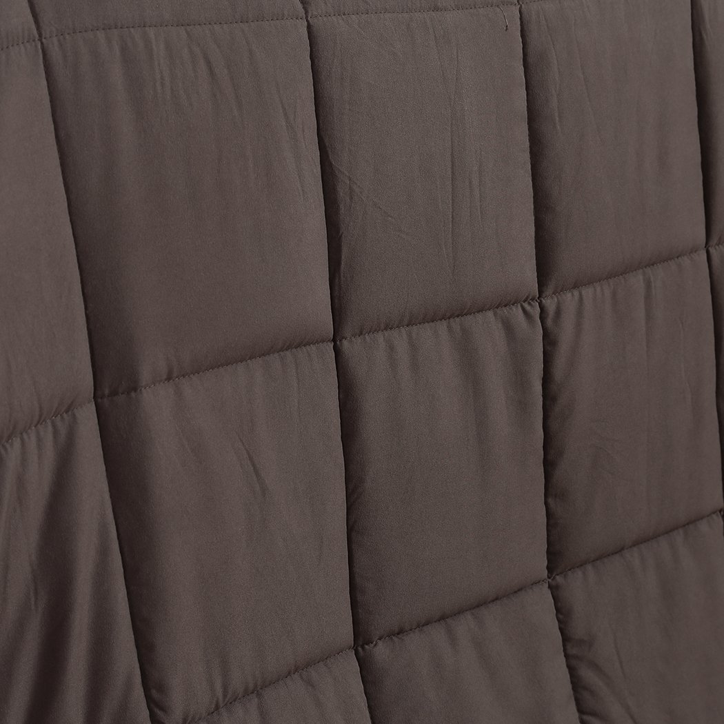 DreamZ Weighted Blanket in mink color, featuring a soft polyester exterior and glass bead filling for deep relaxation and comfort.