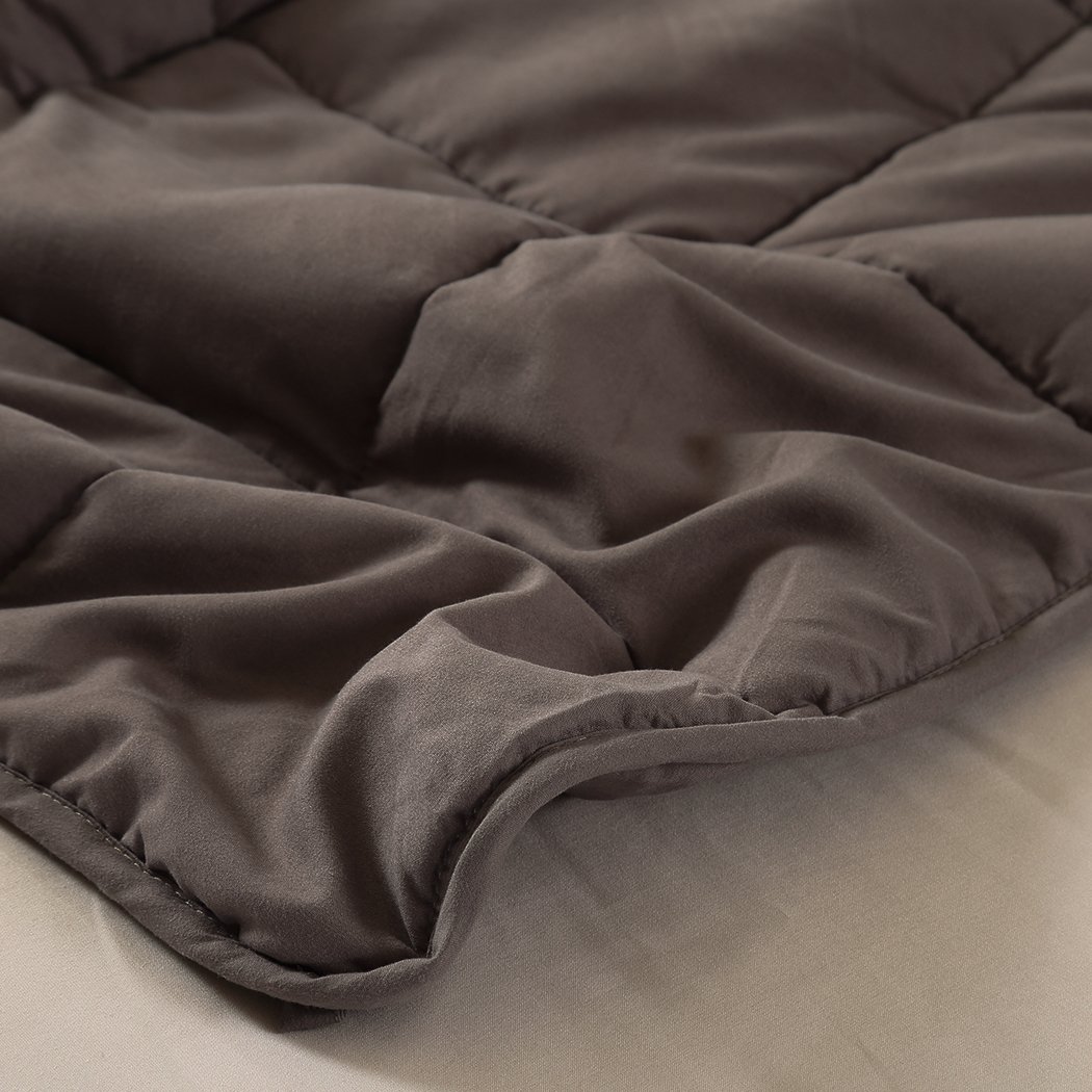 DreamZ Weighted Blanket in mink color, featuring a soft polyester exterior and glass bead filling for deep relaxation and comfort.