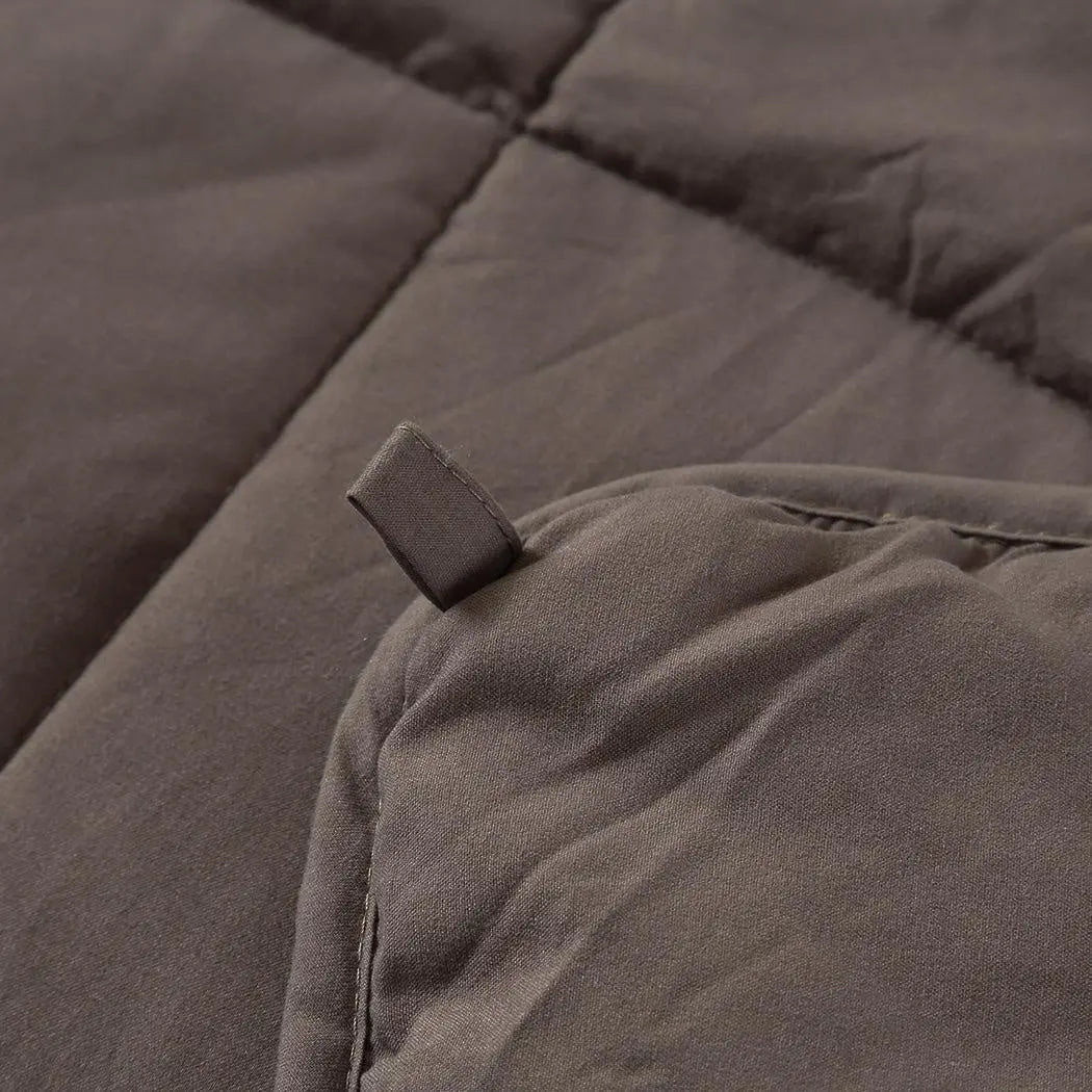 DreamZ Weighted Blanket in mink color, featuring a soft polyester fabric and glass bead filling for deep relaxation and comfort.