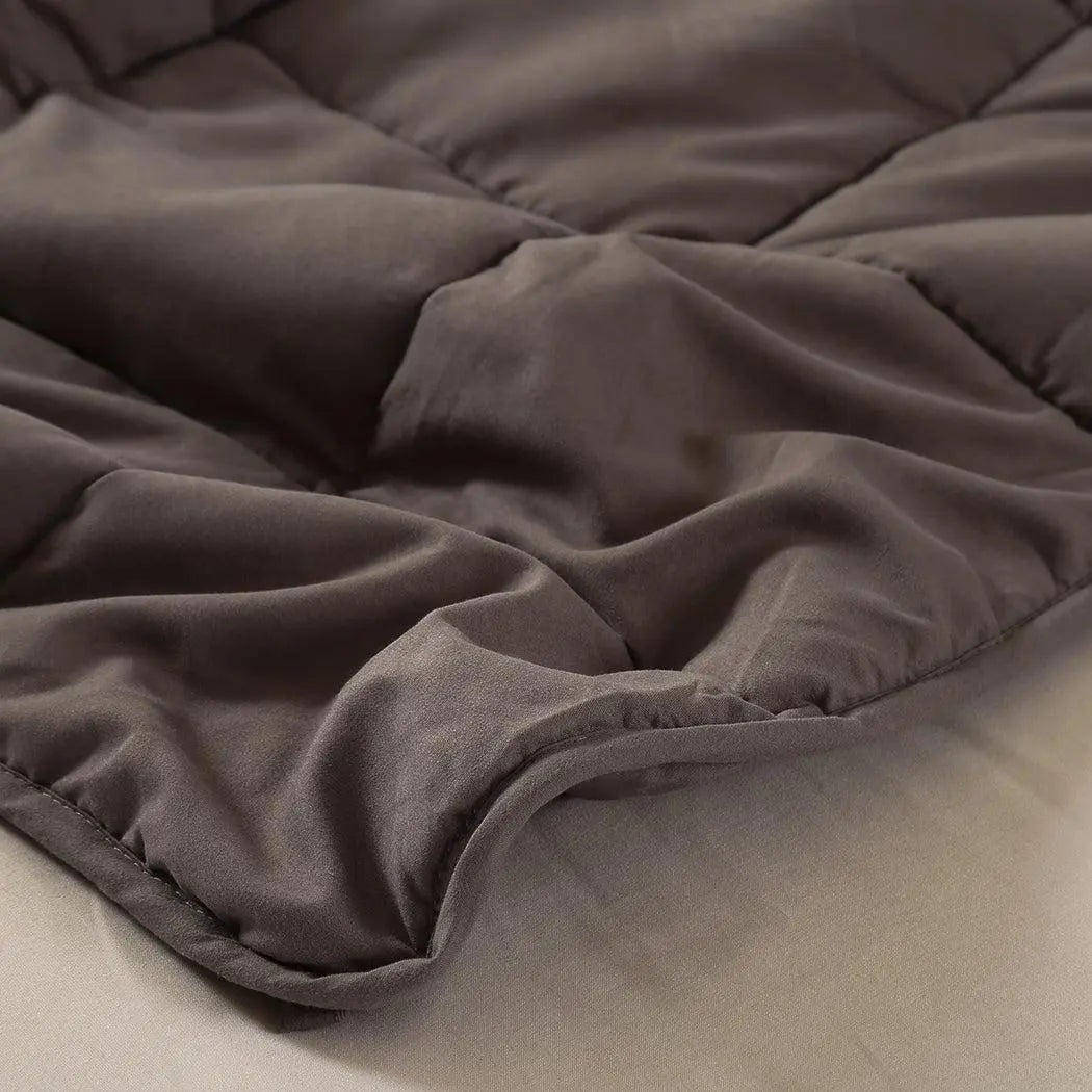 DreamZ Weighted Blanket in mink color, featuring a soft polyester fabric and glass bead filling for deep relaxation and comfort.