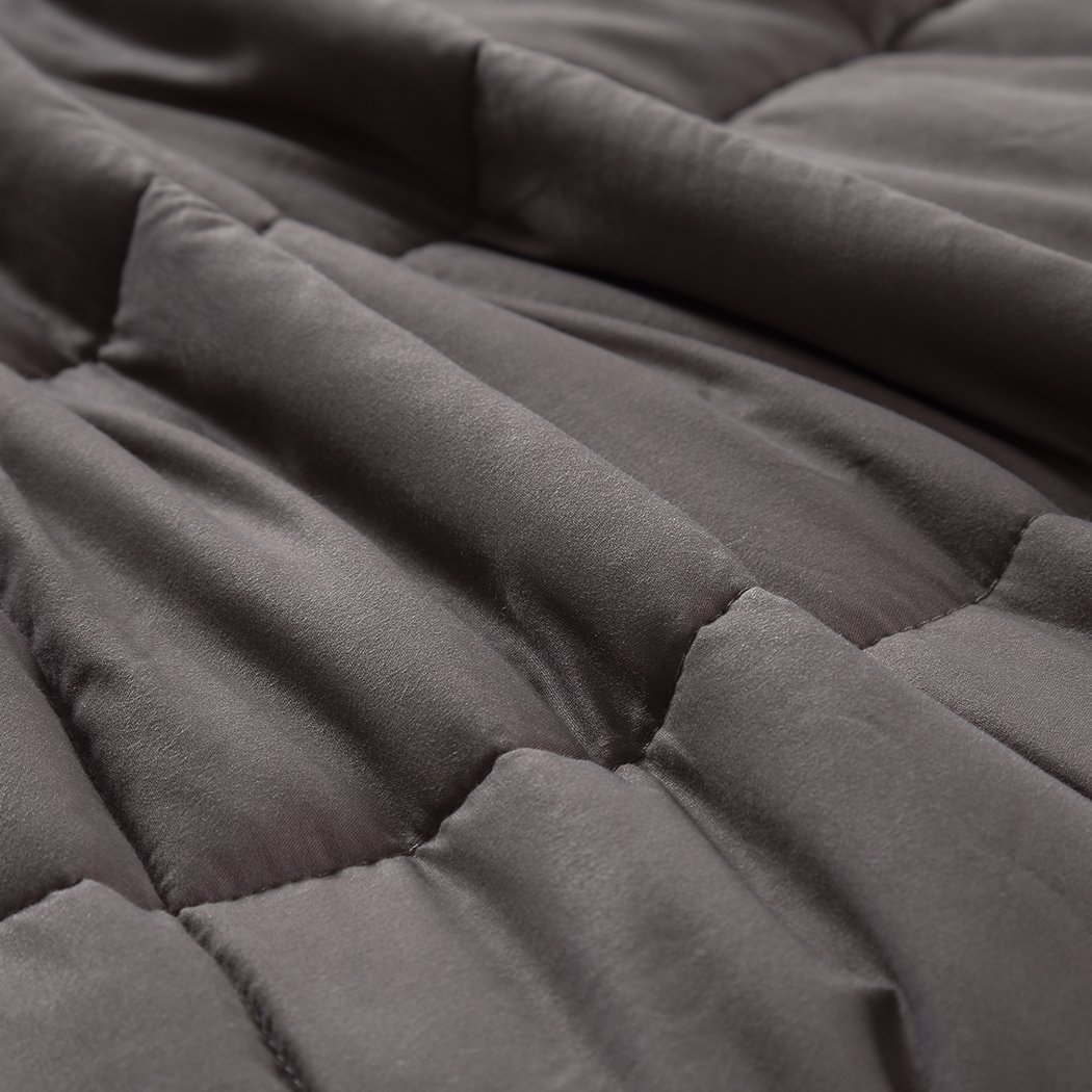 DreamZ Weighted Blanket in grey color, featuring a soft polyester exterior and glass bead filling for deep relaxation.