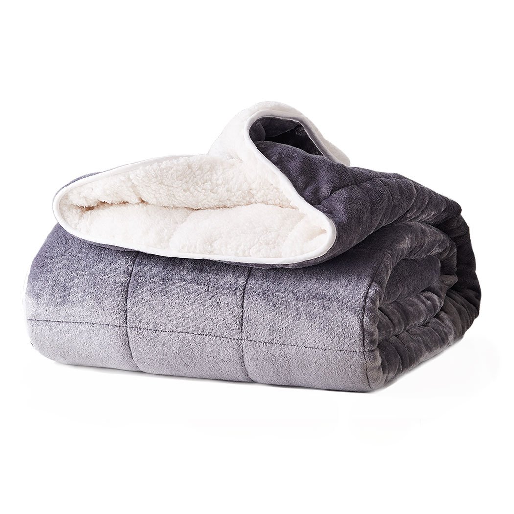 DreamZ Weighted Blanket in grey and white, showcasing its soft fleece and flannel sides, designed for deep relaxation and comfort.