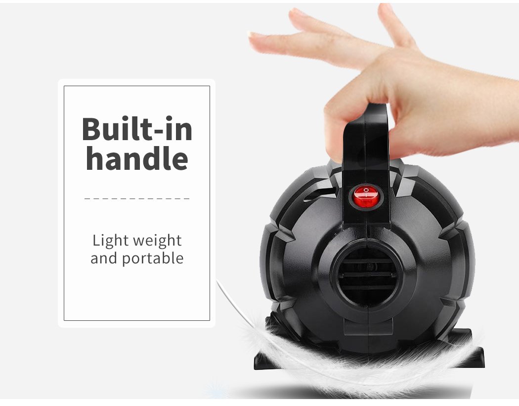 Hand holding a compact vacuum.