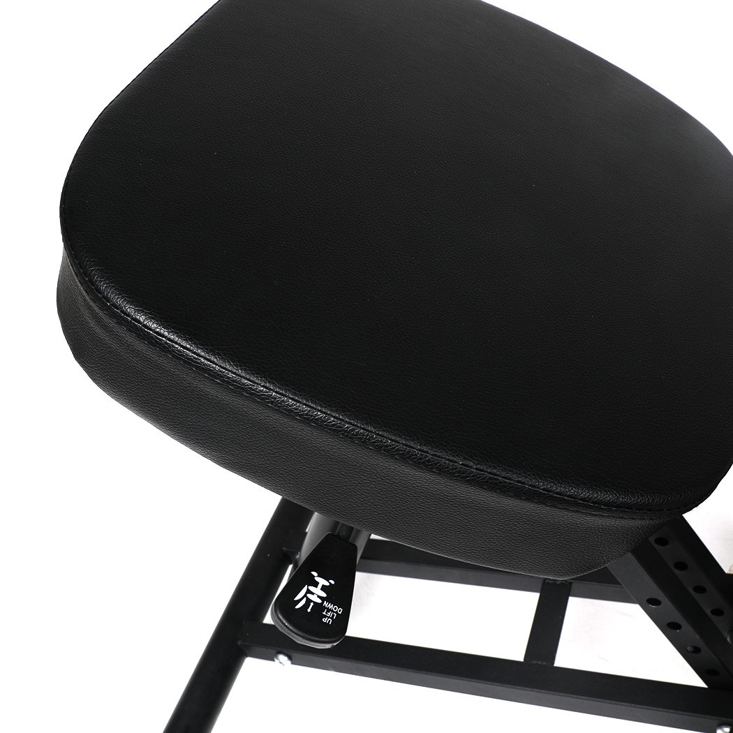 Ergonomic kneeling chair with adjustable height and padded seat, designed for home office use.