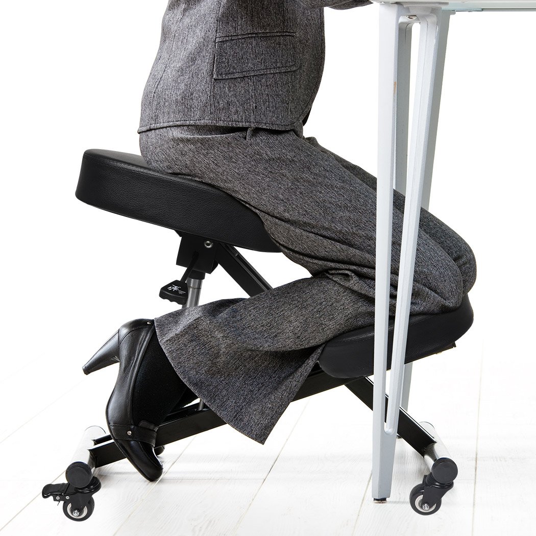 Ergonomic kneeling chair with adjustable height and padded seat, designed for home office use.