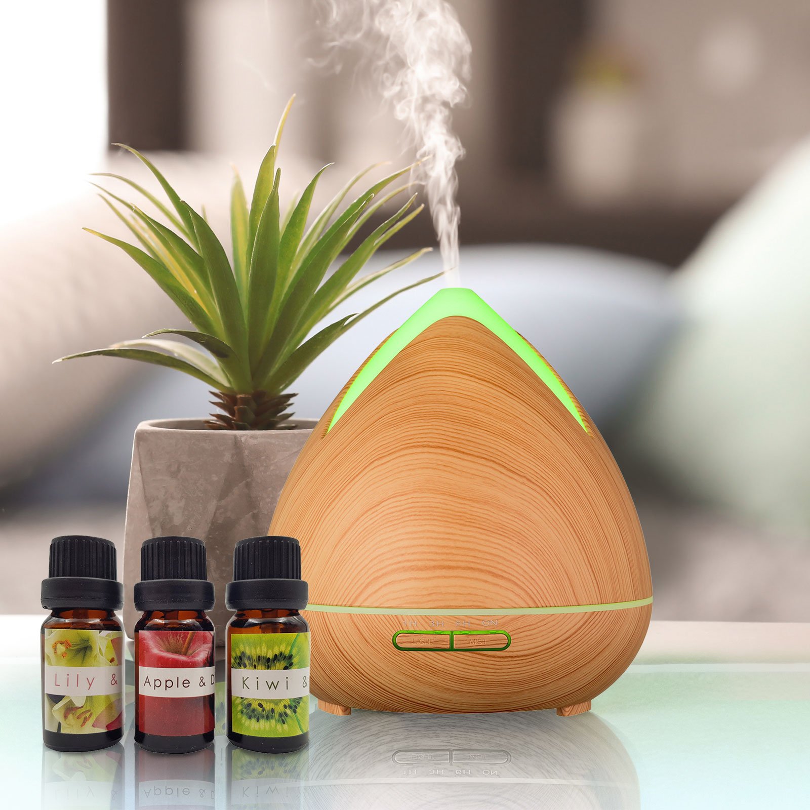 Essential Oils Ultrasonic Aromatherapy Diffuser by PureSpa with 7 LED lights and essential oils.