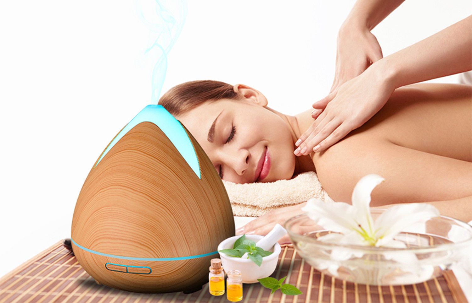 Essential Oils Ultrasonic Aromatherapy Diffuser by PureSpa with 7 LED lights and essential oils.