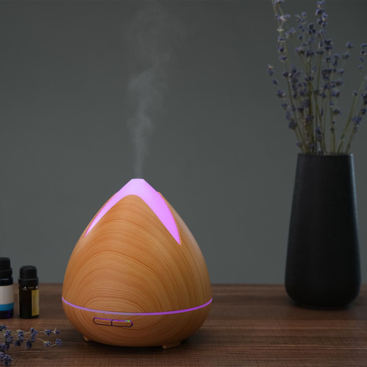 Essential Oils Ultrasonic Aromatherapy Diffuser by PureSpa with 7 LED lights and essential oils.