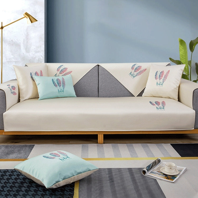 Feather Pattern Summer Ice Silk Non-slip Full Coverage Sofa Cover displayed on a sofa, showcasing its vibrant colors and elegant design.