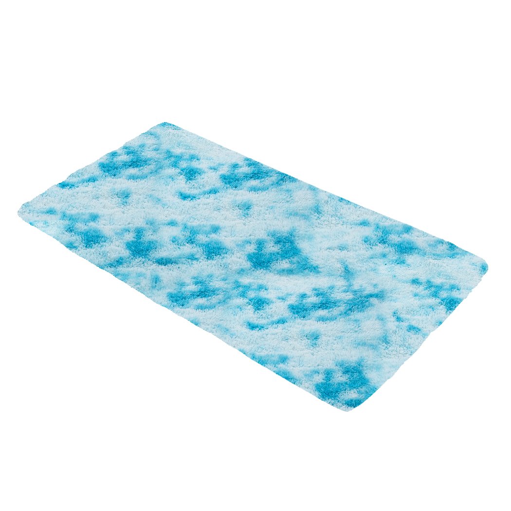 Soft shaggy tie-dyed floor rug in vibrant colors, perfect for home decor and comfort.