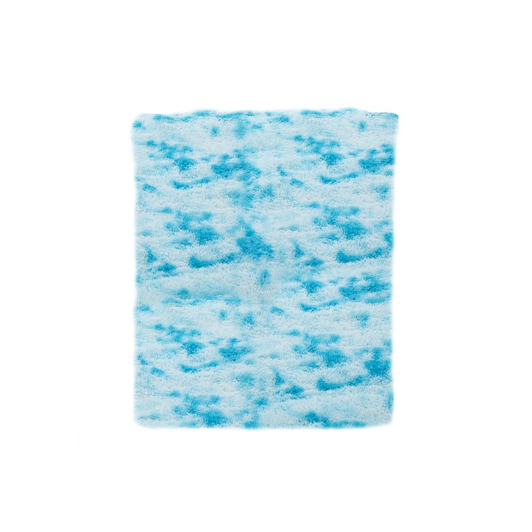 Soft shaggy tie-dyed floor rug in vibrant colors, perfect for home decor and comfort.