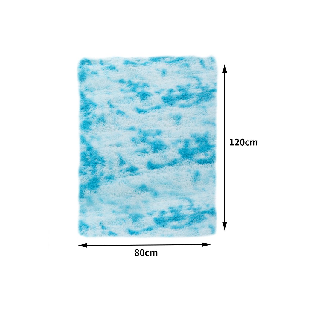 Soft shaggy tie-dyed floor rug in vibrant colors, perfect for home decor and comfort.