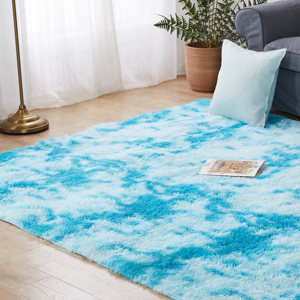 Soft shaggy tie-dyed floor rug in vibrant colors, perfect for home decor and comfort.