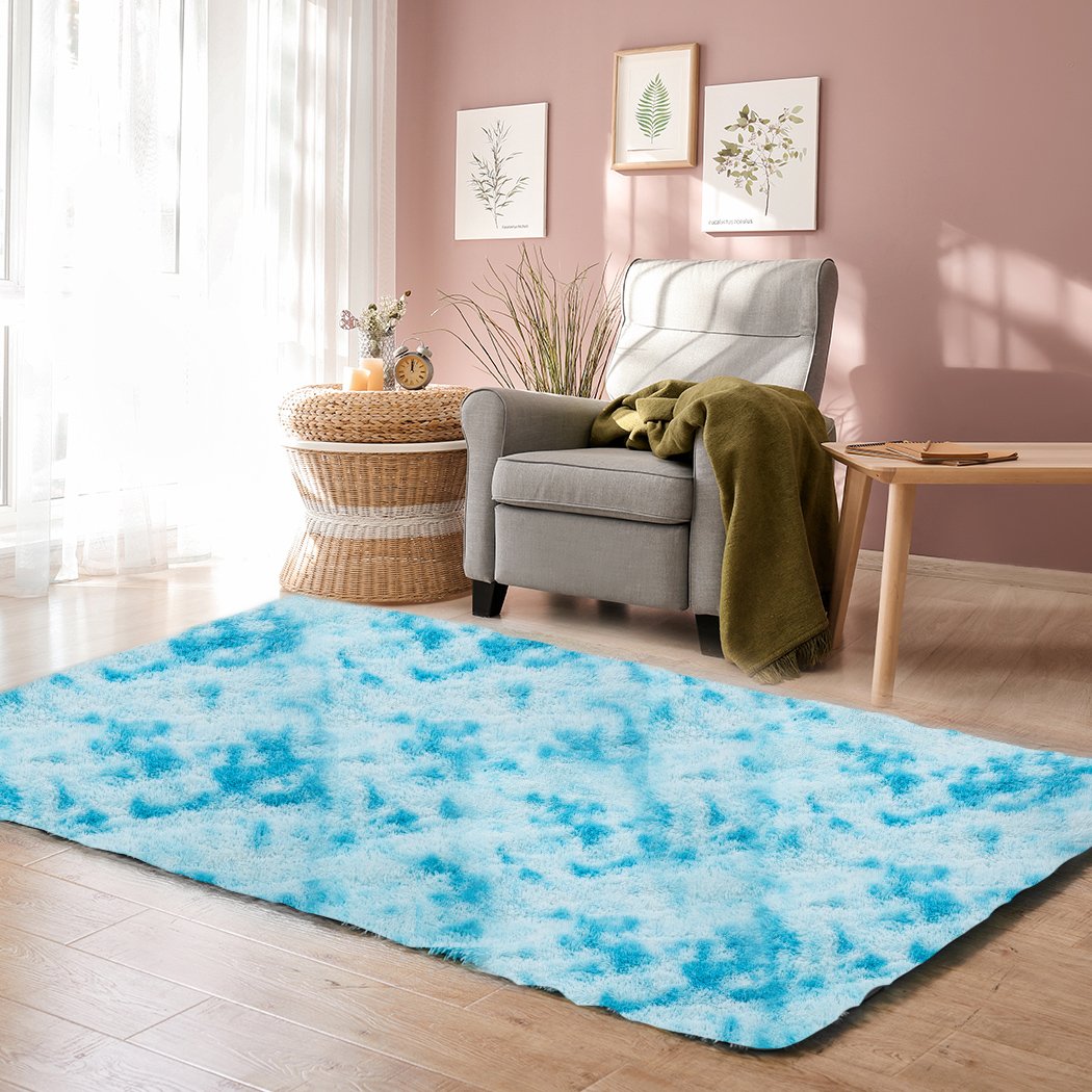 Soft shaggy tie-dyed floor rug in vibrant colors, perfect for home decor and comfort.